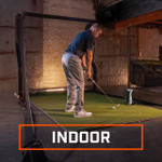 Golfer Using Launch Pro Launch Monitor Indoors Hitting Into A Net